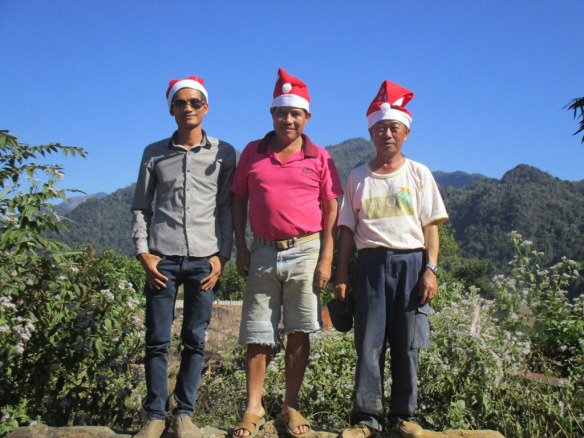 The hats were a big hit.  Siphan is standing with the engineer and the village chief