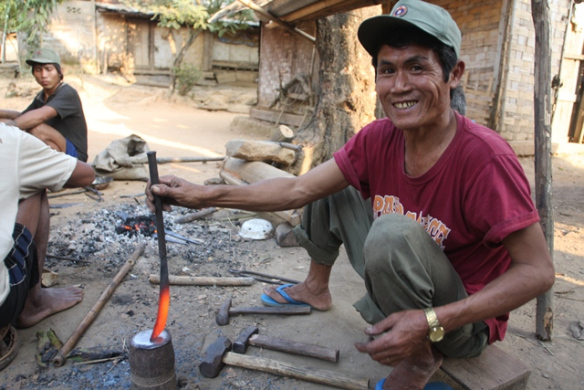 Villager forming a knife - it is a solid piece of metal and he is holding the top of it just  a few inches from the glow - my skin would have peeled off!